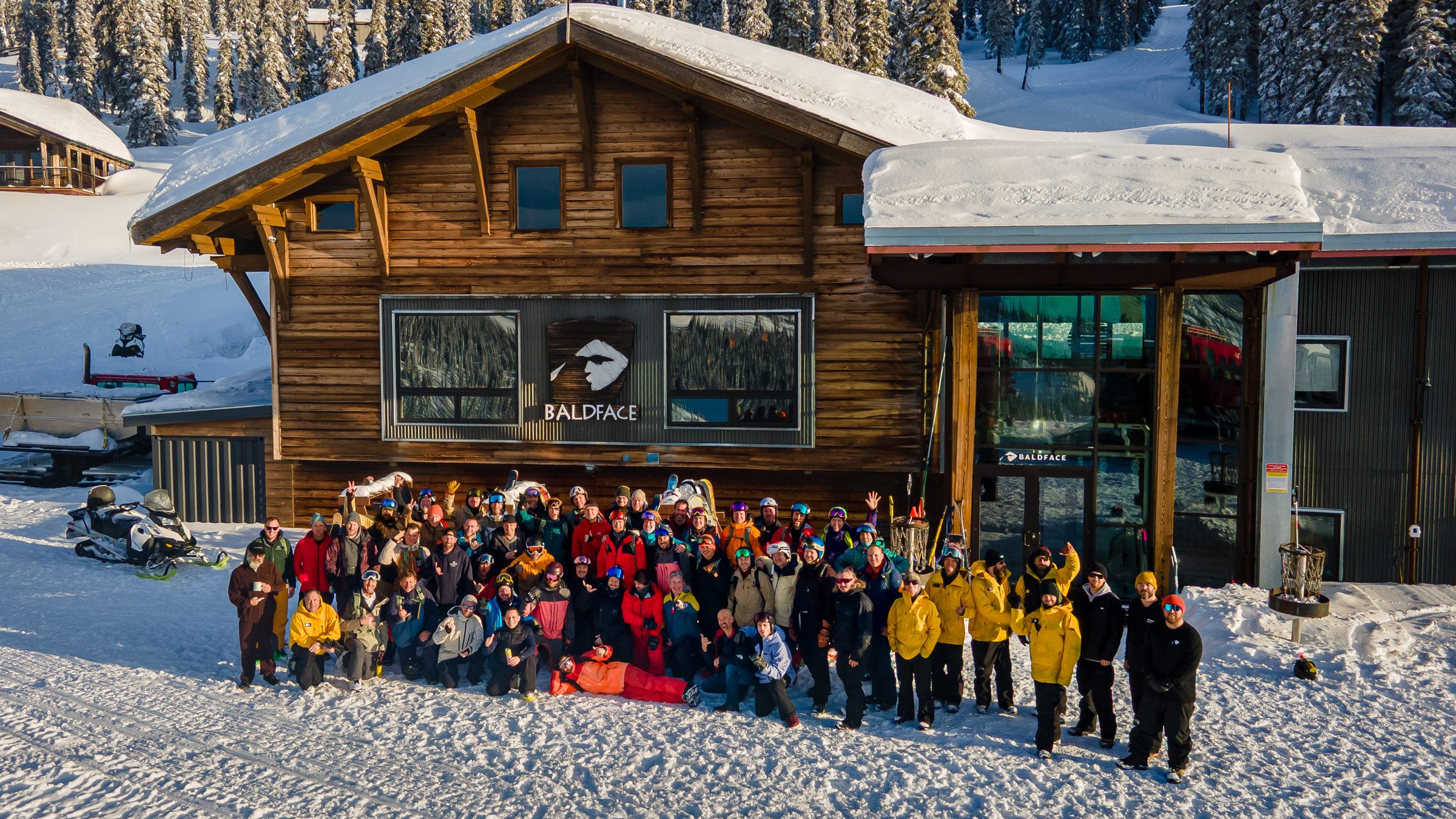Maple Summit group in front of Baldface Lodge at golden hour